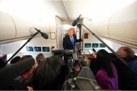 Trump ketika bercakap kepada pemberita di dalam pesawat Air Force One. FOTO: AFP