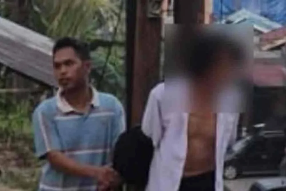 Seorang lelaki diikat pada tiang elektrik kerana membawa lari isteri orang. Foto Agensi