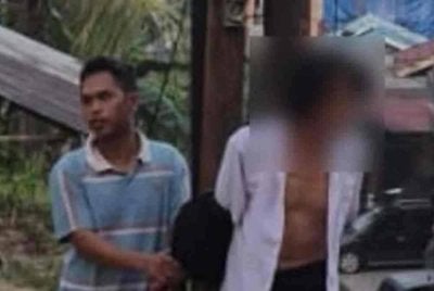 Seorang lelaki diikat pada tiang elektrik kerana membawa lari isteri orang. Foto Agensi