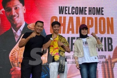 Aliff Rakib (tengah) memasang impian untuk bergelar juara sebenar dengan membawa pulang satu lagi tali pinggang. Foto SINAR HARIAN/HAZELEN LIANA KAMARUDIN