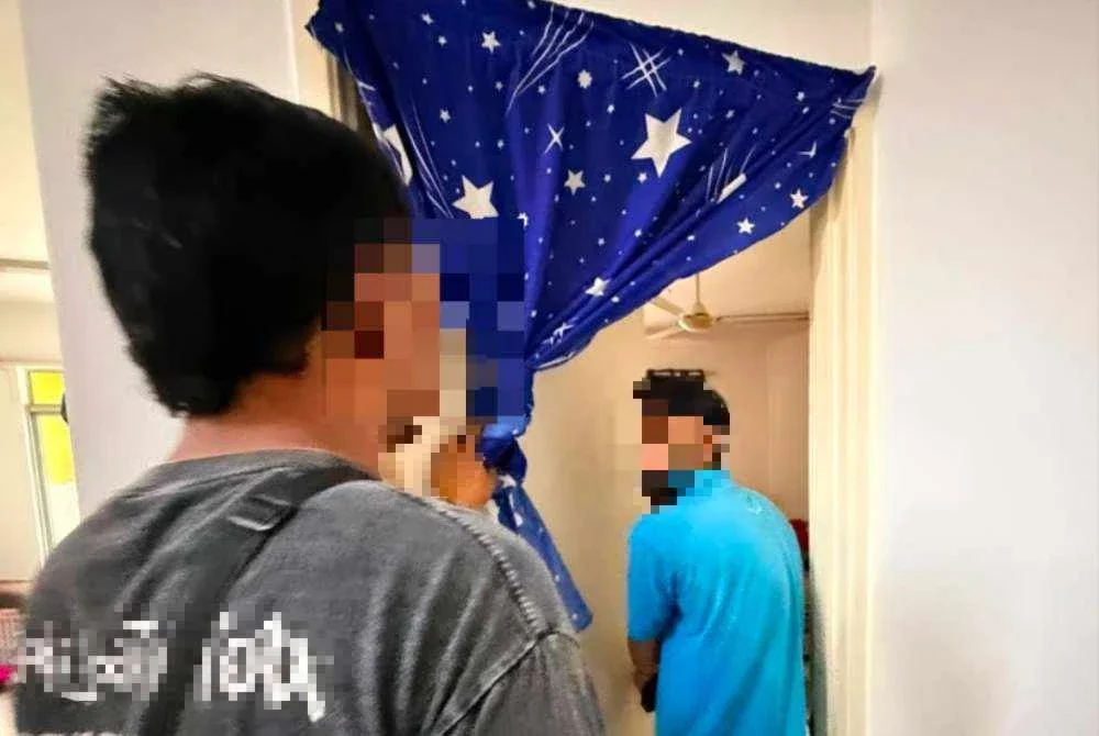 Seorang lelaki Pakistan yang tular dalam kenderaan dengan logo JIM ditahan di sebuah kondominium di Setapak pada Ahad. Foto: JIM