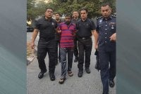 Md Idris dibawa polis ke Mahkamah Seremban pada Rabu.