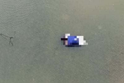 Mayat wanita yang ditemui dalam beg di tengah Sungai Perak. 