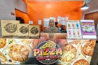 Keazaman Hazarini untuk menghasilkan piza mengikut selera tempatan akhirnya membuahkan hasil yang membanggakan apabila diterima orang ramai