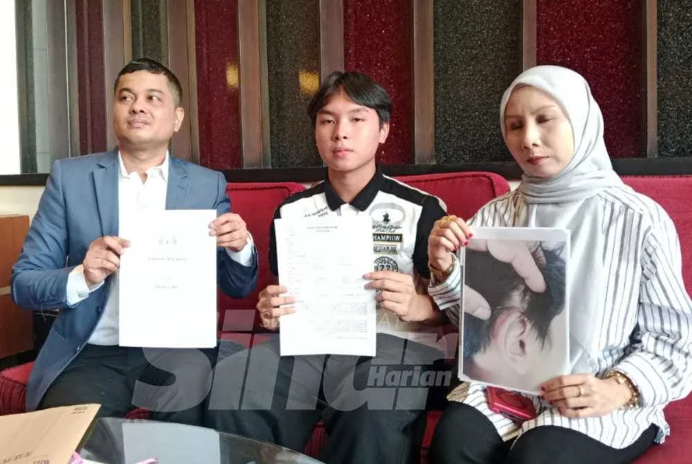 Adryz (tengah) didakwa mengalami kecederaan pada kepala, telinga, leher dan badan selepas diserang ketika dalam perjalanan ke kelas kira-kira jam 8.30 pagi.
