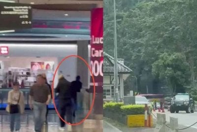 Tangkap layar rakaman video tular memaparkan individu dipercayai suspek melarikan diri selepas melakukan rompak kedai emas dalam pusat beli-belah di Genting Highlands pada Isnin.