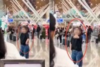 Tangkap layar rakaman video tular seorang wanita warga China disyaki kurang siuman bertindak agresif mengganggu pengunjung lain di Terminal 1 KLIA.