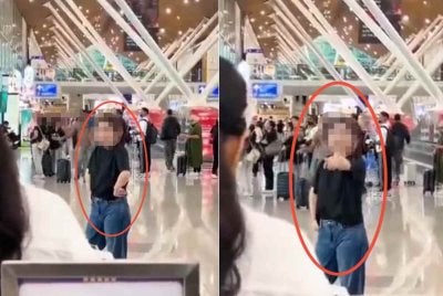 Tangkap layar rakaman video tular seorang wanita warga China disyaki kurang siuman bertindak agresif mengganggu pengunjung lain di Terminal 1 KLIA.