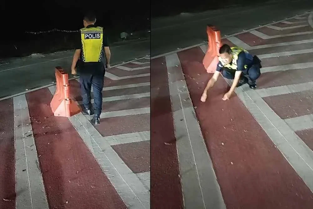 Tangkap layar video tular yang memaparkan seorang anggota polis mengutip paku yang ditabur pihak tidak bertanggungjawab di jejambat Cybersouth.