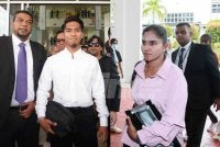 Roghini Devi (kanan) dan Muhammad Shah mengaku tidak bersalah di Mahkamah Sesyen pada Khamis. 