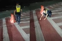 Tangkap layar video tular yang memaparkan seorang anggota polis mengutip paku yang ditabur pihak tidak bertanggungjawab di jejambat Cybersouth. 
