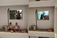 Dua lelaki terperangkap di koridor luar tingkat 14, bahagian belakang sebuah pangsapuri di Jalan Lenggong Symphony Park, Jelutong pada Sabtu. Foto JBPM Pulau Pinang
