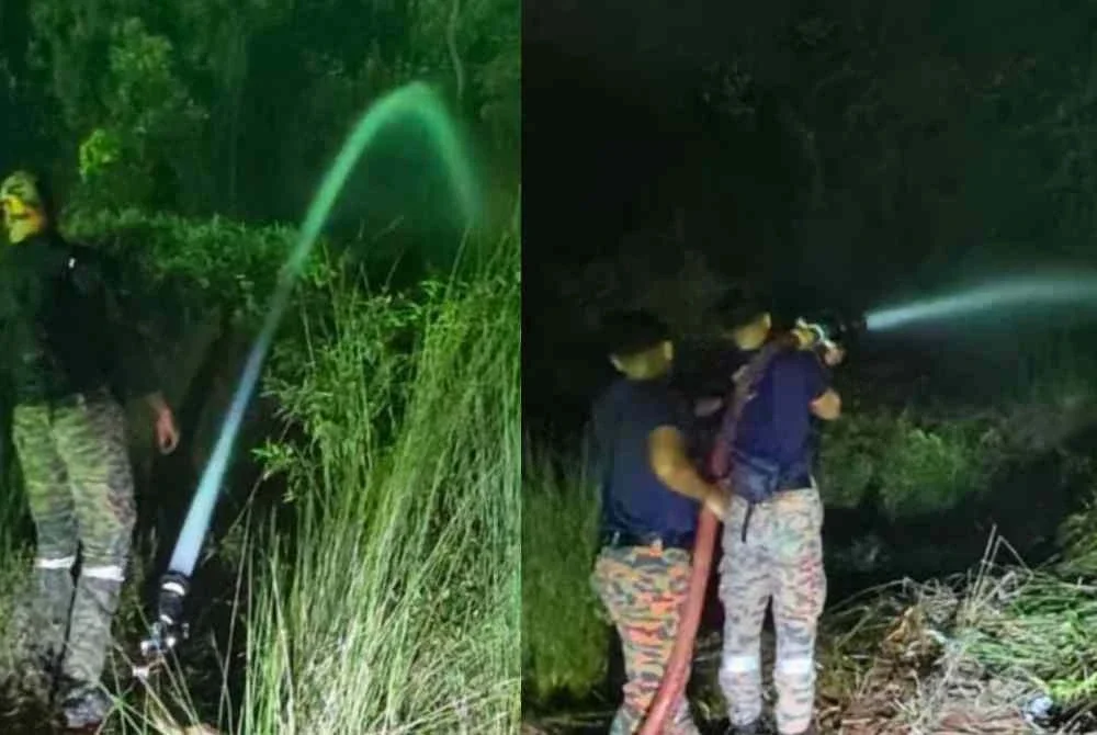 Anggota bomba goat memadamkan kebakaran tanah gambut di Jalan Bypass Punggai - Sebana Cove