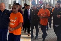 Orang yang disyaki diiringi pegawai SPRM bagi pernohonan reman pada Khamis.
