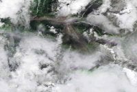 Imej satelit pada 26 Ogos 2026 yang dikeluarkan oleh Planet Labs pada 27 Ogos 2026 menunjukkan pemandangan dari udara Shyaphrubesi dan Sungai Bhote Koshi selepas dilanda banjir besar di daerah Rasuwa, Nepal pada 26 Ogos 2026. - AFP