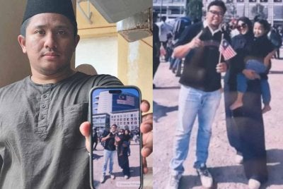 Mohd Hafiz menunjukkan gambar kenangan arwah adiknya bersama keluarga ketika menyambut hari kebangsaan di Putrajaya.