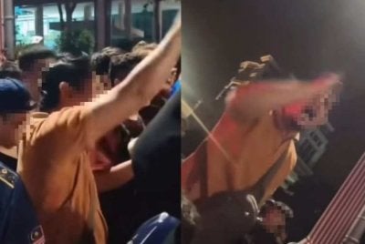 Tular beberapa rakaman video yang memaparkan seorang lelaki berbaju coklat mencetuskan provokasi terhadap anggota polis yang bertugas.