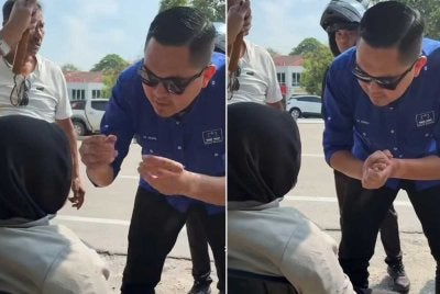 Akmal memberikan bantuan awal kepada wanita berkenaan yang terlibat kemalangan.