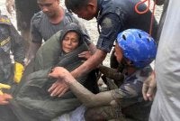 Chandrika Shrestha, 64, berjaya diselamatkan dari kediamannya di daerah Nuwakot pada Sabtu. Foto: AFP