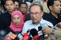 Anwar ditemu bual pemberita selepas hadir pada Majlis Perhimpunan Bulanan Kementerian Perladangan dan Komoditi pada Selasa. Foto Bernama