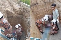 Anggota bomba turun ke lubang tangki untuk membawa mangsa naik - Foto: JBPM