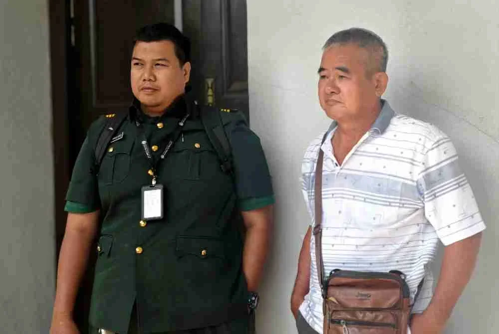 Kai Sang (kanan) didenda RM6,0000 kerana menceroboh hutan simpan.