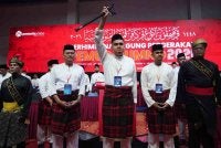 Muhamad Akmal (tengah) ketika hadir menyampaikan ucapan dasar Perhimpunan Pemuda UMNO 2026 di WTC Di sini pada Khamis .