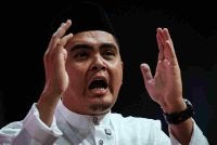 Dr Muhamad Akmal menyampaikan ucapan dasar pada Perasmian Perhimpunan Agung Pergerakan Pemuda UMNO 2026 sempena Perhimpunan Agung UMNO 2026 di Dewan Merdeka, Pusat Dagangan Dunia Kuala Lumpur pada Khamis. Foto Bernama