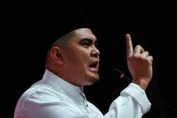 Dr Muhamad Akmal menyampaikan ucapan dasar pada Perasmian Perhimpunan Agung Pergerakan Pemuda UMNO 2026 sempena Perhimpunan Agung UMNO 2026 di Dewan Merdeka, Pusat Dagangan Dunia Kuala Lumpur pada Khamis. Foto Bernama 