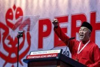 Presiden UMNO Datuk Seri Dr Ahmad Zahid Hamidi ketika menyampaikan Ucapan Dasar Presiden sempena Perhimpunan Agung UMNO 2026 di Dewan Merdeka, Pusat Dagangan Dunia Kuala Lumpur pada Sabtu. Foto Bernama
