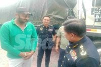 Seorang lelaki warga India yang ditahan dalam Ops Kenderaan Perdagangan di Hentian Rehat dan Rawat (RnR) Rawang arah utara, pada Selasa.