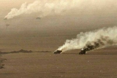 Kenderaan tentera yang terbakar selepas diserang Huthi di al-Jawf, Yemen. - AFP