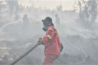 Peningkatan jumlah titik panas dikesan di Sumatera Selatan, Jambi dan Riau, sekali gus memerlukan pemantauan intensif diteruskan. Foto AFP