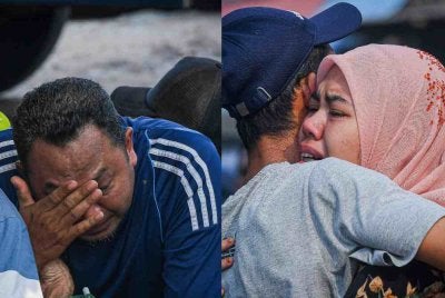 Ahli keluarga tidak dapat menahan kesedihan susulan penemuan satu mayat daripada tiga pemancing hilang di perairan Hutan Melintang, Perak, semalam. Foto Bernama