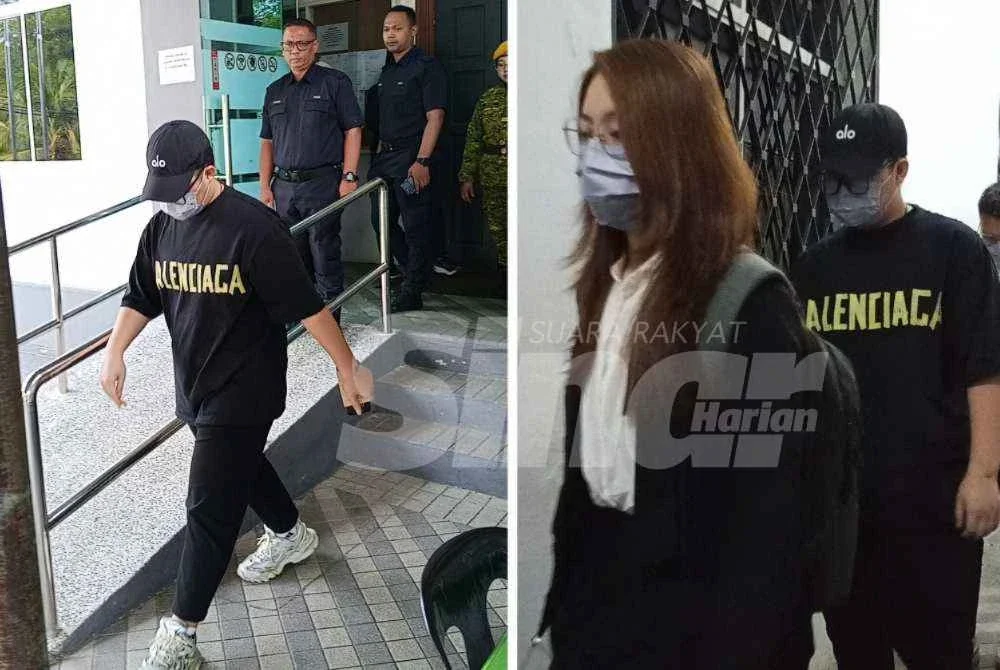 Goh Yin Zun (depan) didakwa di Mahkamah Majistret Kluang pada Jumaat.
