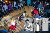 Jenazah tiga sekeluarga yang maut dalam kebakaran selamat dikebumikan dalam satu liang lahad di Tanah Perkuburan Islam Tambun di sini kira-kira jam 8.25 malam Ahad. Foto Bernama 