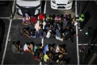 Antara warga asing yang diperiksa dalamoperasi penguatkuasaan di Flat Sri Kolam, Kuala Terengganu, awal pagi Isnin.