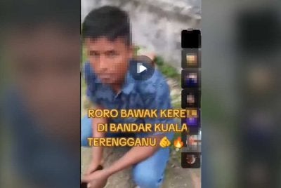 Tangkap layar video tular menunjukkan seorang pelarian Myanmar yang ditahan sekumpulan lelaki selepas disyaki memandu kereta secara haram di Kuala Terengganu.