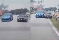 Tangkap layar video tular memaparkan aksi kereta berwarna hitam dipandu lelaki terbabit menghimpit sebuah kenderaan lain di Jalan Pantai Sepat. 