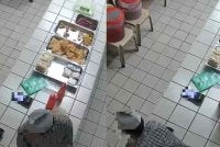 Rakaman CCTV yang memaparkan pelajar berkenaan yang memakai baju kurta kelabu berseluar hitam serta berkopiah memanjat kaunter sebelum mengambil wang bersebelahan peti duit.
