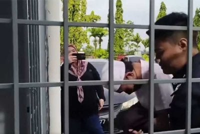 Abdullah Mustakim, 33, ketika dibawa ke Mahkamah Majistret Kuala Krai pada Rabu. 
