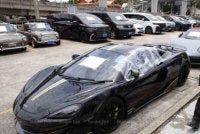 Kenderaan mewah antara aset bernilai 65 juta baht yang disita dalam kes penipuan pertukaran mata wang asing. Foto Agensi