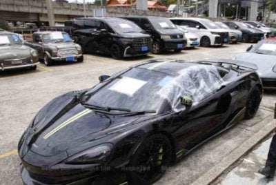 Kenderaan mewah antara aset bernilai 65 juta baht yang disita dalam kes penipuan pertukaran mata wang asing. Foto Agensi