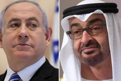 Netanyahu (kiri) didakwa mengadakan pertemuan tertutup dengan Mohamed Zayed.