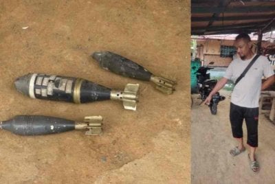 Md Raduan menunjukkan tempat tiga butir disyaki bom mortar yang diletakkannya di depan rumahnya di Kampung Dato Ahmad Razali, Sepang pada Jumaat.