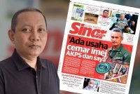 Laporan Sinar Harian pada Jumaat dan Zaki (kiri).
