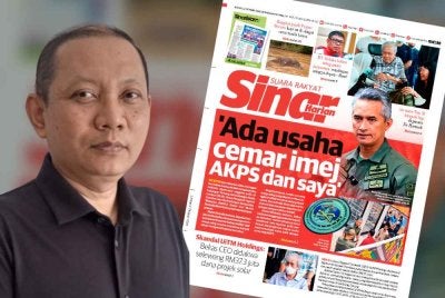 Laporan Sinar Harian pada Jumaat dan Zaki (kiri).