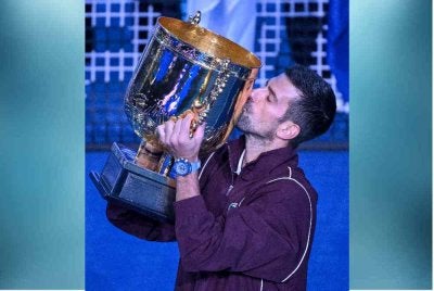 Djokovic muncul juara Terbuka China selepas de Minaur terpaksa menarik diri pada final akibat kecederaan. Foto: AFP.