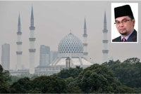 Sekitar bandar raya Shah Alam terjejas akibat diselubungi jerebu. Foto kecil: Mohd Shahzihan