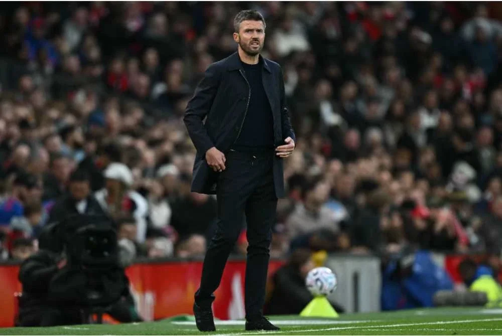 Reaksi kecewa Carrick selepas United terikat 1-1 dengan Spurs dalam aksi EPL di Old Trafford pada Ahad. Foto: AFP